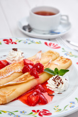 crepes with strawberry sauce and whipped cream