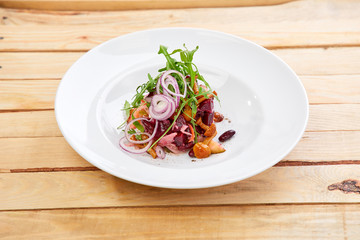 vegetarian salad with beetroot, honey agaric and red onion