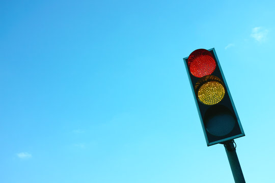 Broken Traffic Light With Yellow & Red Lights On