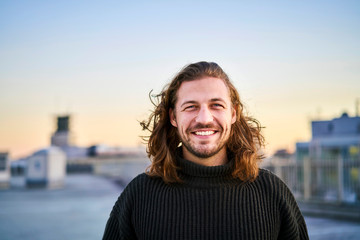 Portrait of bearded young man smiling