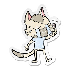 distressed sticker of a cartoon crying wolf