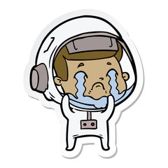 sticker of a cartoon crying astronaut