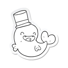 sticker of a cartoon laughing whale with top hat