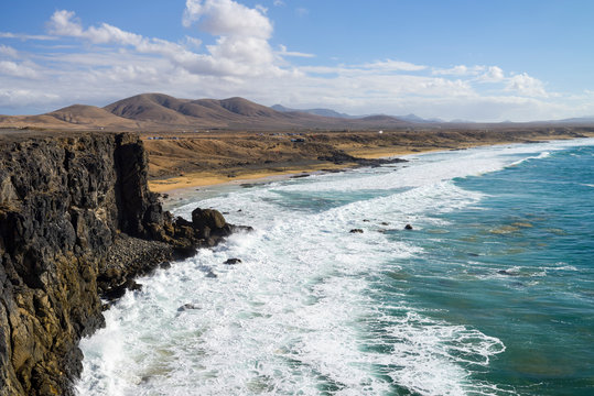 Spain, Canary Islands, Fuerteventura, view to cliff coast and beach near El Cotillo