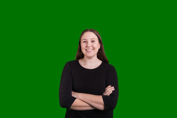 Beautiful young woman crossed arms nice smile on green screen