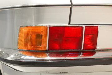 Part of silver oldtimer with rear light