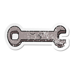 distressed sticker of a cartoon spanner