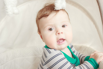 Portrait of joyfil, happiness baby in the bedroom, blurred background