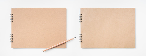 kraft notebook and pen on white background