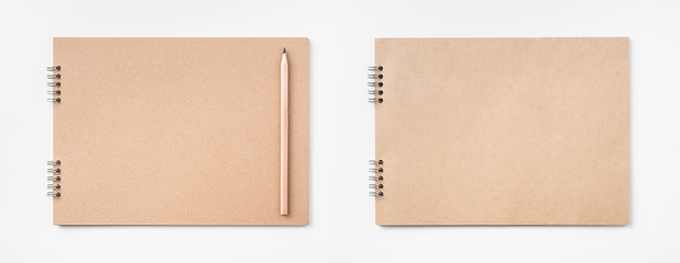 kraft notebook and pen on white background