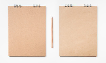 kraft notebook and pen on white background