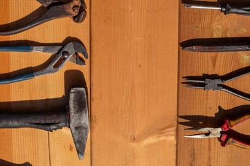 Tool set and instruments for hand work and fixing on wooden surface background. Close up top side view mockup design production details.