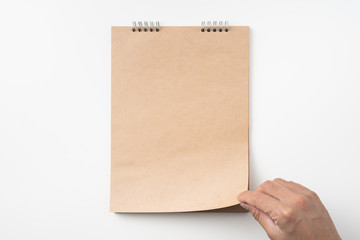 man's hand turn up kraft page on white