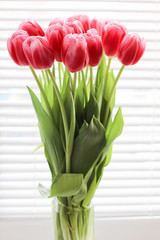 Bouquet of pink fresh tulips. Greeting card. Modern photo.