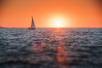 Sailing yacht in the sea at sunset. Adriatic Sea.