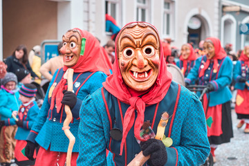 Funny witch in blue robe with red headscarf, in southern Germany Black Forest.