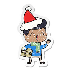 distressed sticker cartoon of a laughing boy wearing santa hat