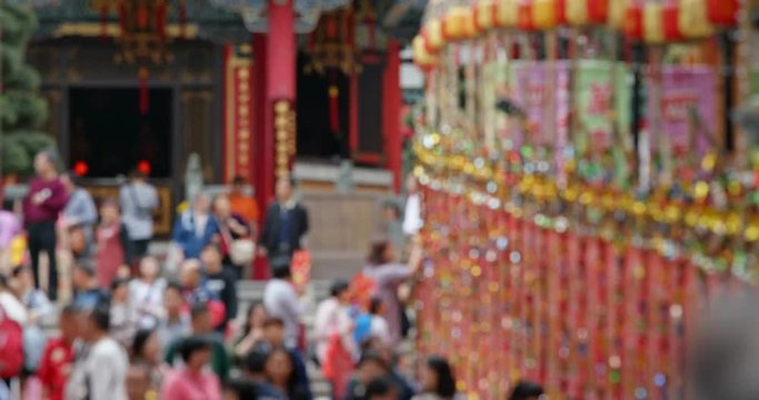 Blur of crowded of people visit chinese temple