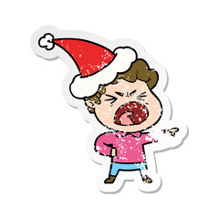 distressed sticker cartoon of a furious man wearing santa hat