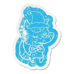 friendly cartoon distressed sticker of a fox wearing santa hat