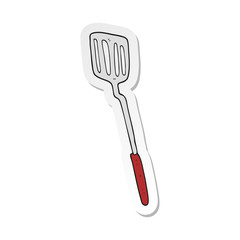 sticker of a cartoon spatula
