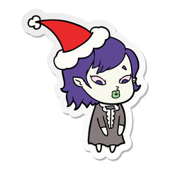 cute sticker cartoon of a vampire girl wearing santa hat