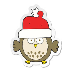 sticker of a cartoon owl wearing christmas hat