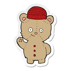 sticker of a cartoon bear in hat