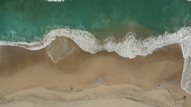 Afternoon camera down drone view from the water and litte waves of Redondo Beach, California. ( DJi Spark Drone footage I 30 fps )