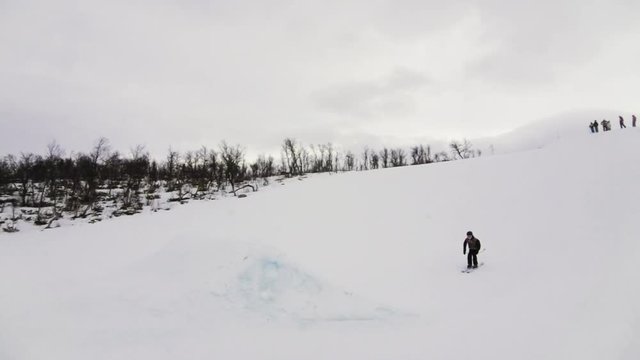 Skier doing a jump on a medium big jump.