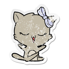 distressed sticker of a cartoon cat with bow on head