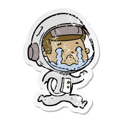 Obraz premium distressed sticker of a cartoon crying astronaut