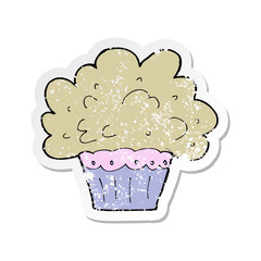 retro distressed sticker of a cartoon big cupcake
