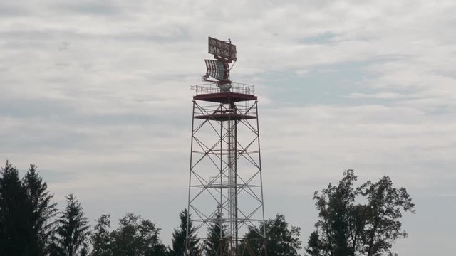 A radar tower spins and checks air traffic.