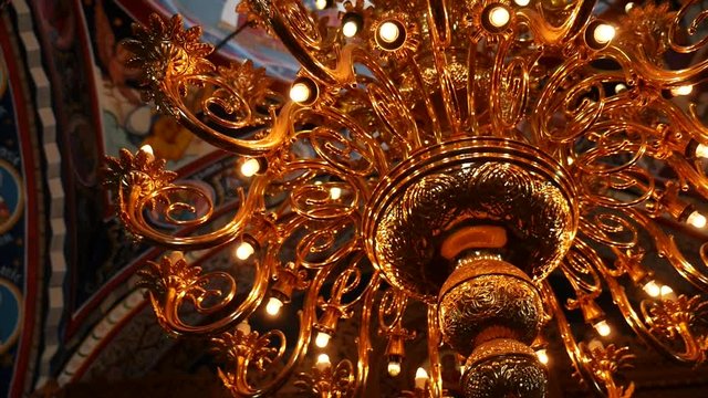 Slow candelabre light inside church wall