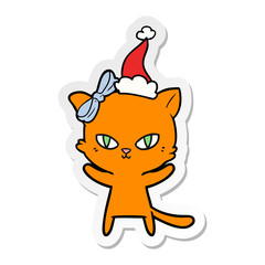 cute sticker cartoon of a cat wearing santa hat