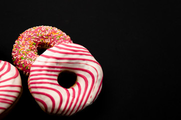 Picture of donuts  frosted, pink glazed and sprinkles donuts isolated on white background