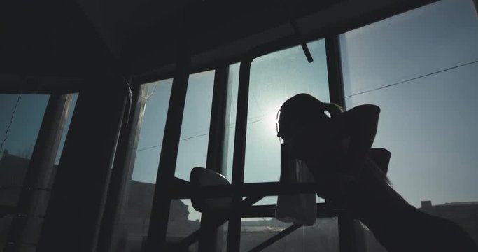 Professional female gymnast training on parallel bars at the gym