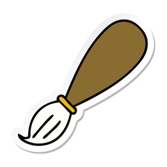 sticker of a cute cartoon paint brush