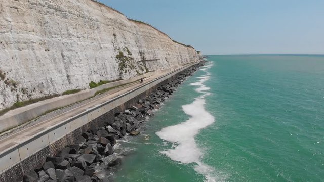 Aerial of Brighton's undercliff walk with bikers on it