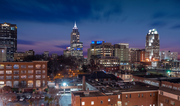 The skyline of Raleigh during a colorful sunset