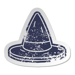 distressed old sticker of a witches hat