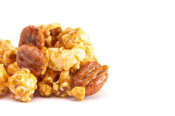 Pile of Caramel Pecan Popcorn on a White Background