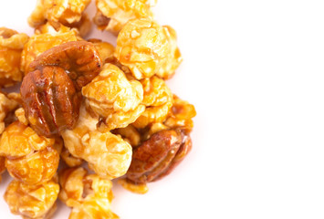 Pile of Caramel Pecan Popcorn on a White Background
