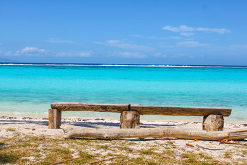 bench on the beach turquoise sea