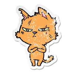 distressed sticker of a tough cartoon cat