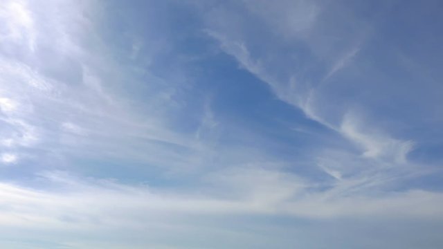 Time-lapse of stratocumulus clouds moving steadily across a blue sky.