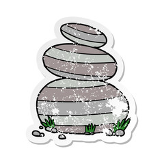 distressed sticker of a cartoon large stacked stones