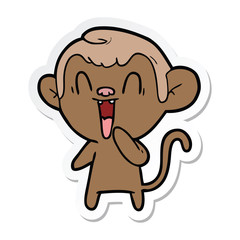 sticker of a cartoon laughing monkey