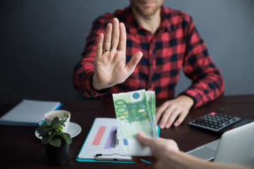 Businessman refusing money